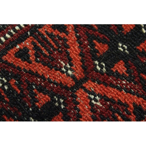 1004 - A BOKHARA RUG, red ground with two rows of eleven gulls (worn). 5ft 4ins x 3ft 2ins.