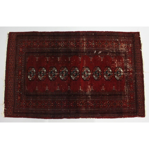 1005 - A BOKHARA RUG, red ground with a single row of nine gulls (worn). 5ft 3ins  x 3ft 4ins.