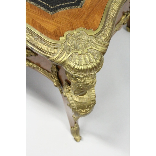 1011 - A GOOD LOUIS XVI DESIGN KINGWOOD AND ORMOLU BUREAU PLAT, of shaped outline, with gilt tooled leather... 