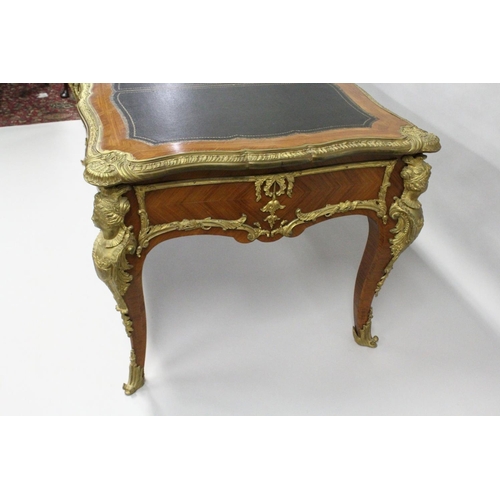 1011 - A GOOD LOUIS XVI DESIGN KINGWOOD AND ORMOLU BUREAU PLAT, of shaped outline, with gilt tooled leather... 