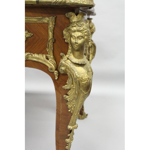 1011 - A GOOD LOUIS XVI DESIGN KINGWOOD AND ORMOLU BUREAU PLAT, of shaped outline, with gilt tooled leather... 