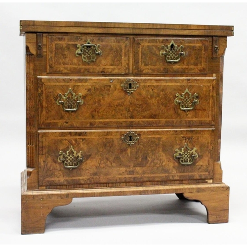 1014 - AN 18TH CENTURY WALNUT BATCHELOR'S CHEST with a crossbanded rectangular fold over top, two small dra... 