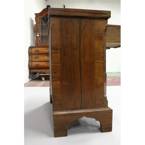 1014 - AN 18TH CENTURY WALNUT BATCHELOR'S CHEST with a crossbanded rectangular fold over top, two small dra... 