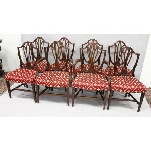 1016 - A SET OF EIGHT GEORGE III MAHOGANY DINING CHAIRS, two with arms, all with shield shaped backs, pierc... 