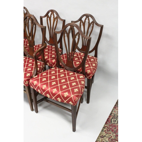 1016 - A SET OF EIGHT GEORGE III MAHOGANY DINING CHAIRS, two with arms, all with shield shaped backs, pierc... 