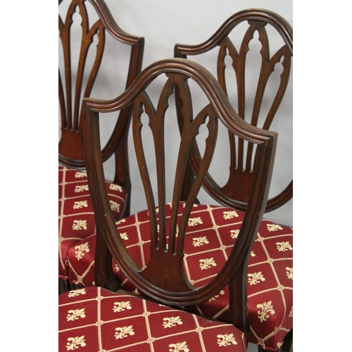 1016 - A SET OF EIGHT GEORGE III MAHOGANY DINING CHAIRS, two with arms, all with shield shaped backs, pierc... 