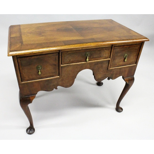 1018 - AN 18TH CENTURY WALNUT LOWBOY with a cross banded and feather banded quarter veneered top, three dra... 