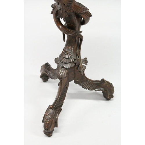 1022 - AN 18TH / 19TH CENTURY ITALIAN CARVED WALNUT BLACKAMOOR TORCHERE  of typical form, with a shaped top... 