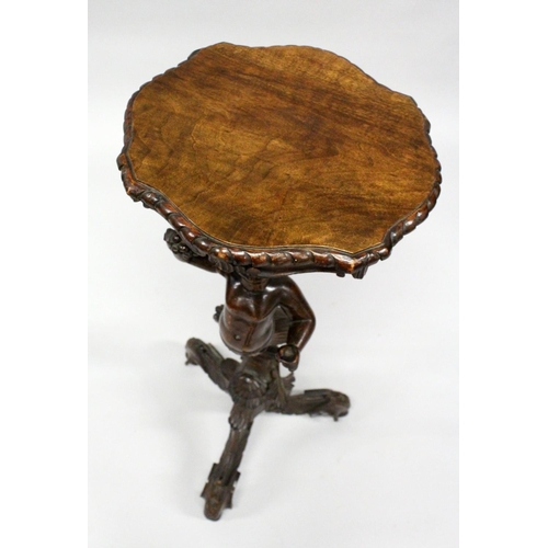 1022 - AN 18TH / 19TH CENTURY ITALIAN CARVED WALNUT BLACKAMOOR TORCHERE  of typical form, with a shaped top... 