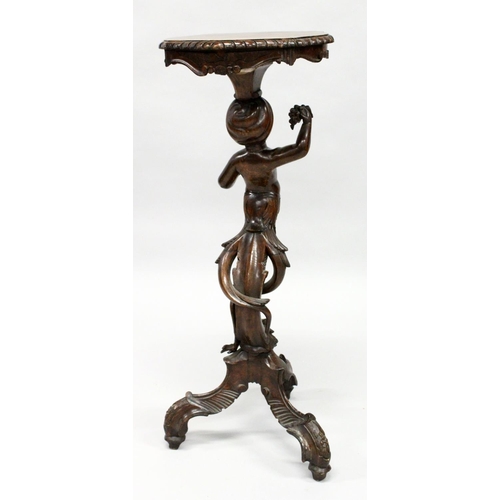 1022 - AN 18TH / 19TH CENTURY ITALIAN CARVED WALNUT BLACKAMOOR TORCHERE  of typical form, with a shaped top... 