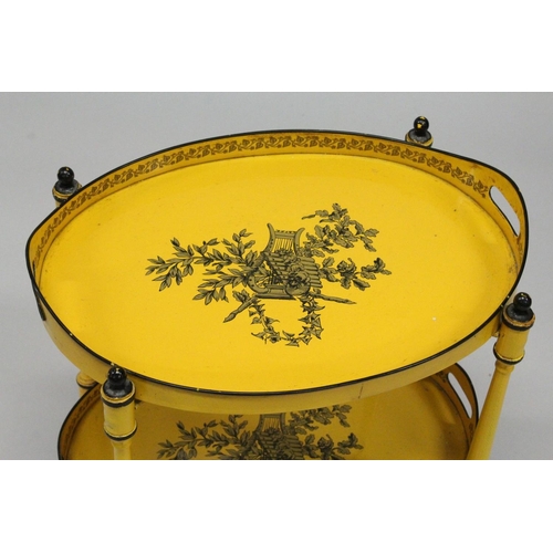 1025 - A GOOD DECORATING TOLEWARE TWO TIER OVAL ETAGERE with lift off trays, yellow ground decorated with c... 