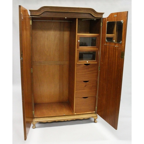 1029 - HARRODS LTD.  A BLONDE WOOD TWO DOOR WARDROBE with shaped cornice, fitted interior on cabriole legs.... 