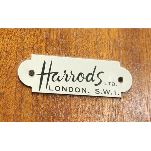 1029 - HARRODS LTD.  A BLONDE WOOD TWO DOOR WARDROBE with shaped cornice, fitted interior on cabriole legs.... 