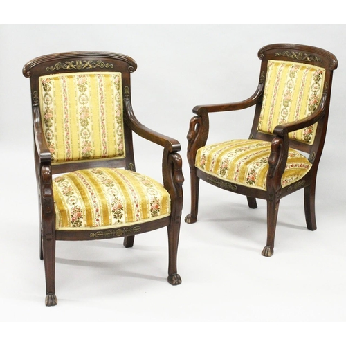 1030 - A GOOD PAIR OF FRENCH EMPIRE MAHOGANY OPEN ARMCHAIRS with reeded curving and cresting rails, upholst... 