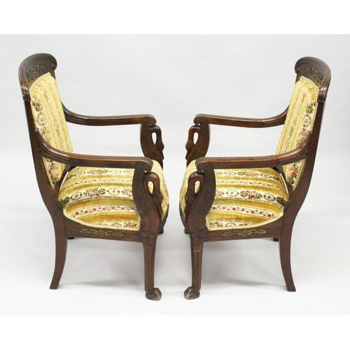 1030 - A GOOD PAIR OF FRENCH EMPIRE MAHOGANY OPEN ARMCHAIRS with reeded curving and cresting rails, upholst... 