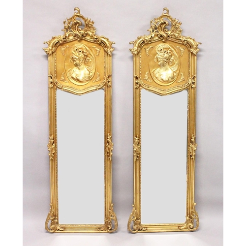 1031 - A LONG PAIR OF UPRIGHT GILT MIRRORS 5ft 9ins long x 1ft 8ins wide.