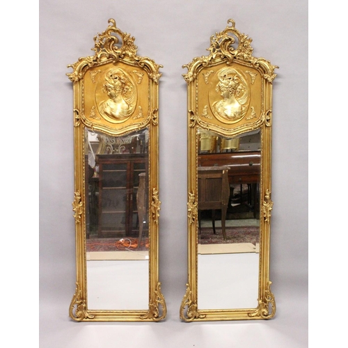 1031 - A LONG PAIR OF UPRIGHT GILT MIRRORS 5ft 9ins long x 1ft 8ins wide.