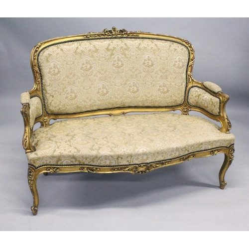 1035 - A 19TH CENTURY FRENCH GILTWOOD FRAMED CANAPE, with carved frame and classical cream upholstery. 4ft ... 