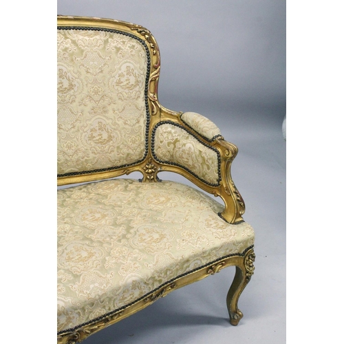 1035 - A 19TH CENTURY FRENCH GILTWOOD FRAMED CANAPE, with carved frame and classical cream upholstery. 4ft ... 