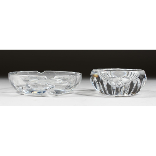 1060 - A HEAVY BACCARAT CIRCULAR GLASS ASHTRAY, 4ins diameter, and ANOTHER, 5ins diameter. (2).