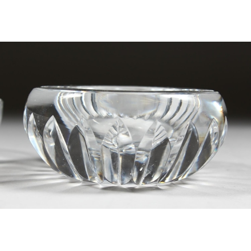 1060 - A HEAVY BACCARAT CIRCULAR GLASS ASHTRAY, 4ins diameter, and ANOTHER, 5ins diameter. (2).