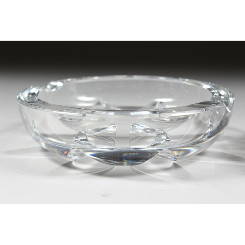 1060 - A HEAVY BACCARAT CIRCULAR GLASS ASHTRAY, 4ins diameter, and ANOTHER, 5ins diameter. (2).