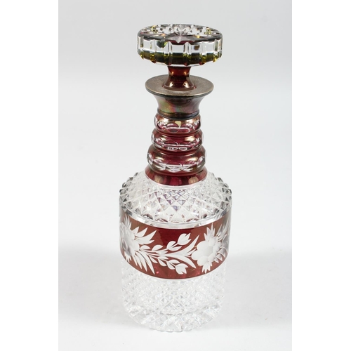 1062 - A VERY GOOD CUT GLASS PLAIN AND RUBY DECANTER AND STOPPER with silver band. 11ins high.