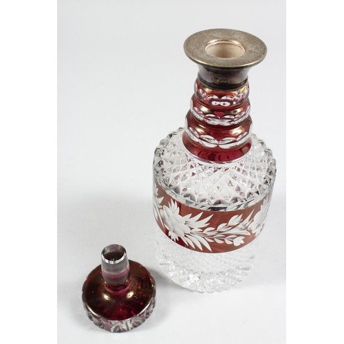 1062 - A VERY GOOD CUT GLASS PLAIN AND RUBY DECANTER AND STOPPER with silver band. 11ins high.