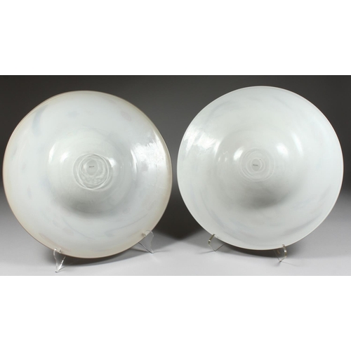 1068 - A PAIR OF LARGE MODERN CIRCULAR SHALLOW DISHES, white opaque ground with colourful decoration. 1ft 6... 