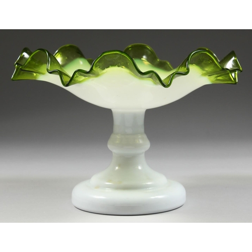 1069 - A ViCTORIAN OPAQUE AND TINTED GREEN GLASS FRILLY EDGE COMPORT, the central base stamped with initial... 