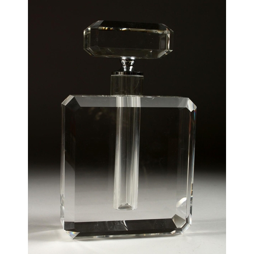 1073 - AN ART DECO STYLE HEAVY GLASS SCENT BOTTLE AND STOPPER. 9.5ins high.