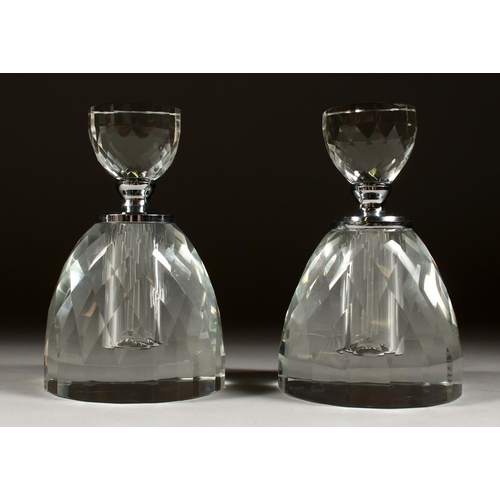 1074 - A PAIR OF CUT GLASS ROUND SCENT BOTTLES AND STOPPERS. 5.5ins high.