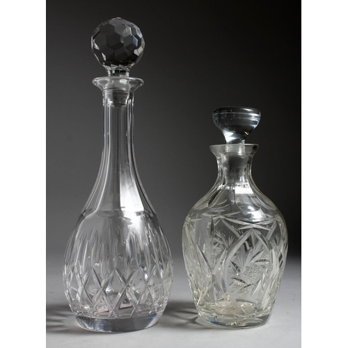 1077 - TWO CUT GLASS DECANTERS AND STOPPERS.