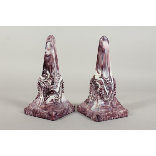 1080 - A PAIR OF SLAG GLASS MARBLE OBELISKS. 8ins high.