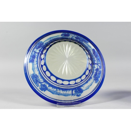 1084 - A BOHEMIAN BLUE TINTED BOWL AND STAND with a landscaped decoration.