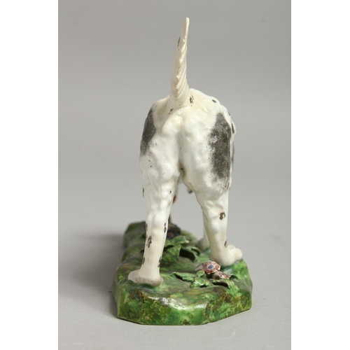 1100 - A 19TH CENTURY DERBY FIGURE OF A HOUND.