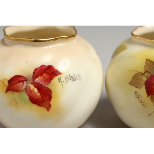 1110 - A PAIR OF ROYAL WORCESTER VASES painted with autumnal leaves and berries by Kitty Blake. Signed K. B... 