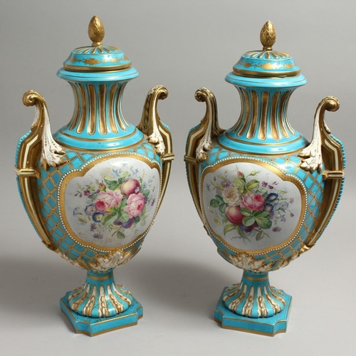 1125 - A VERY GOOD PAIR OF 19TH CENTURY SEVRES PALE BLUE TWO HANDLED URNS AND COVERS painted with reverse p... 