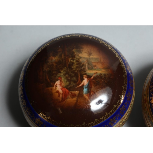 1137 - A PAIR OF VIENNA CIRCULAR PORCELAIN BOXES AND COVERS 3.5ins high.