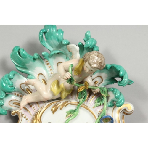 1147 - A PAIR OF THREE-BRANCH PORCELAIN WALL LIGHTS IN THE MEISSEN STYLE, decorated with cherubs, flowers, ... 