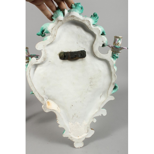 1147 - A PAIR OF THREE-BRANCH PORCELAIN WALL LIGHTS IN THE MEISSEN STYLE, decorated with cherubs, flowers, ... 