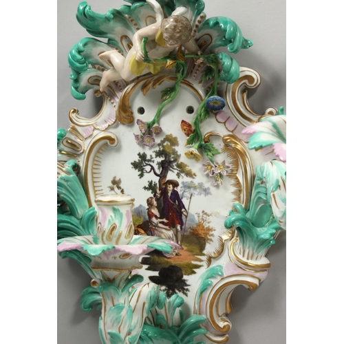 1147 - A PAIR OF THREE-BRANCH PORCELAIN WALL LIGHTS IN THE MEISSEN STYLE, decorated with cherubs, flowers, ... 