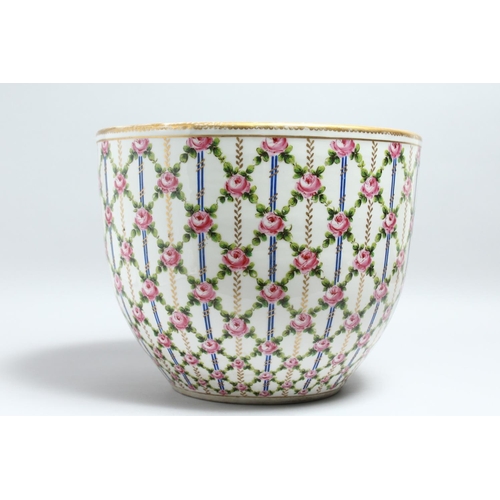 1149 - A GOOD LARGE SEVRES PORCELAIN BOWL OR JARDINIERE, painted with a trellis design with pink roses. 14.... 