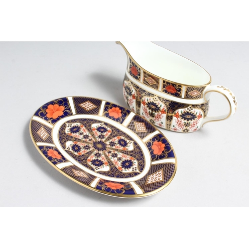 1159 - A  ROYAL CROWN DERBY OLD IMARI PATTERN SAUCE BOAT AND STAND, NO. 1128.