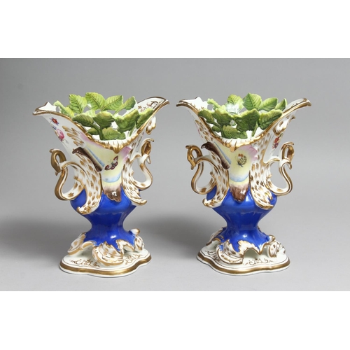 1179 - A PAIR OF COALPORT VASES with blue ground, moulded with leaves and painted with butterflies.