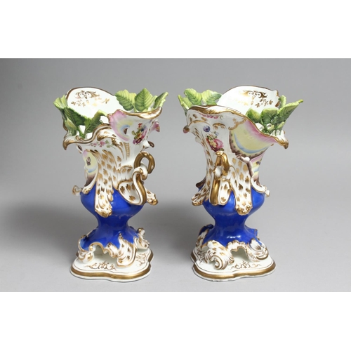 1179 - A PAIR OF COALPORT VASES with blue ground, moulded with leaves and painted with butterflies.