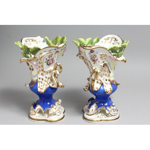 1179 - A PAIR OF COALPORT VASES with blue ground, moulded with leaves and painted with butterflies.