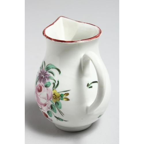 1187 - AN 18TH CENTURY BRISTOL JUG painted with a large floral spray and scattered flowers.