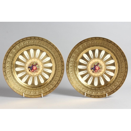 1197 - A GOOD PAIR OF AYNSLEY FRUIT PLATES with gold borders. 10ins diameter.