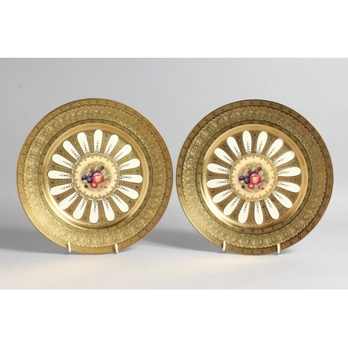 1200 - A GOOD PAIR OF AYNSLEY FRUIT PLATES with gold borders. 10ins diameter